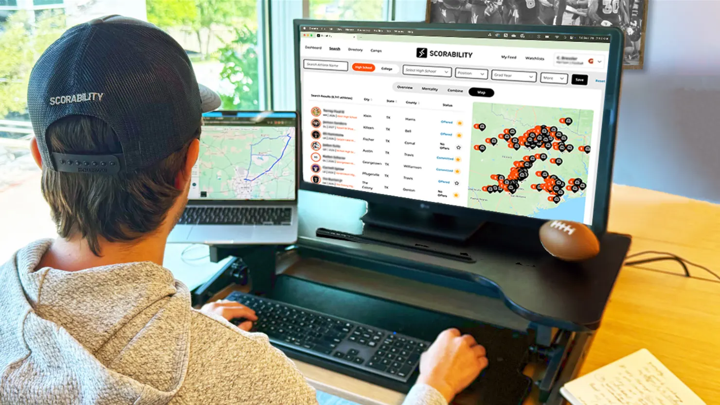 Person sitting at computer leveraging Scorability platform